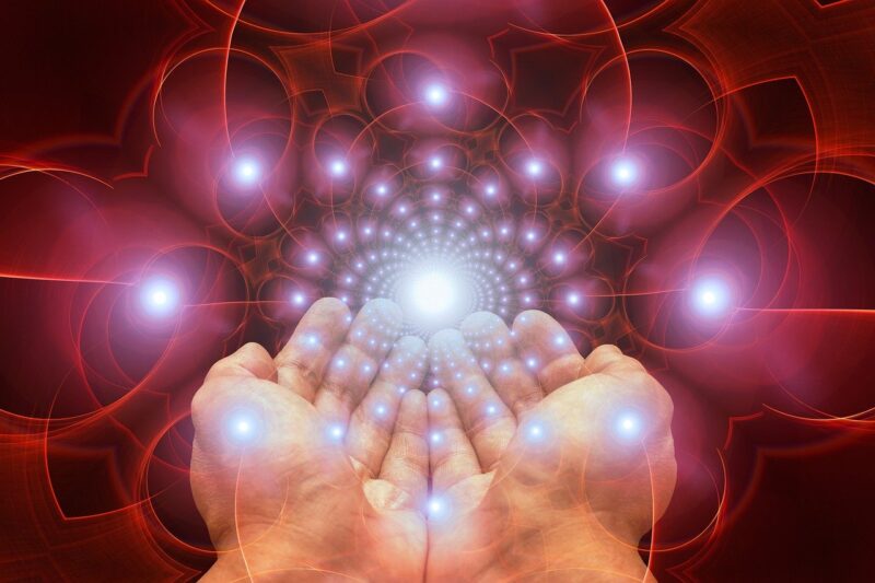 hand with glowing sparks